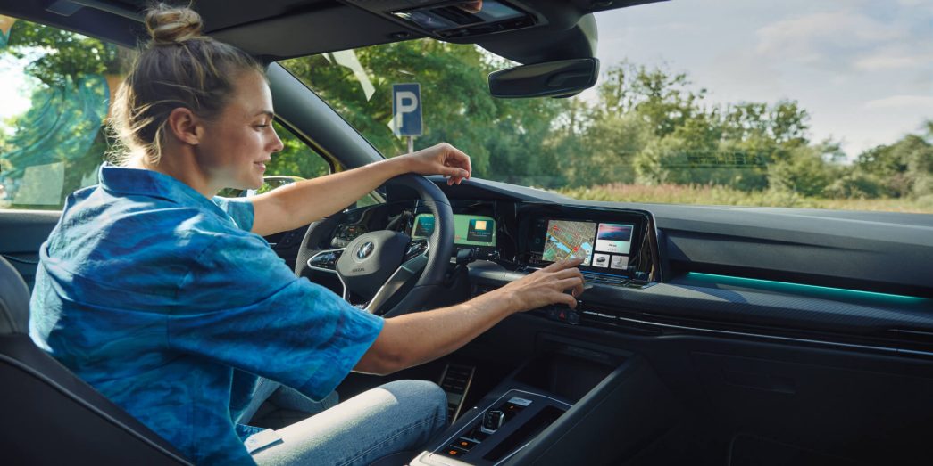 Woman at the steering wheel of the VW Golf Variant