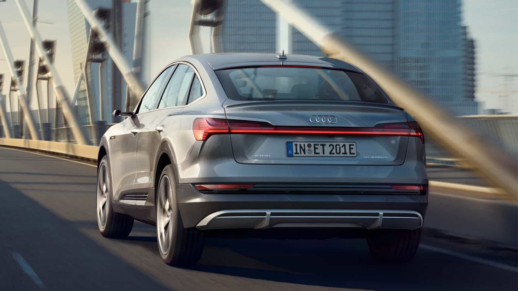 Grey Audi e-tron rear view on a bridge