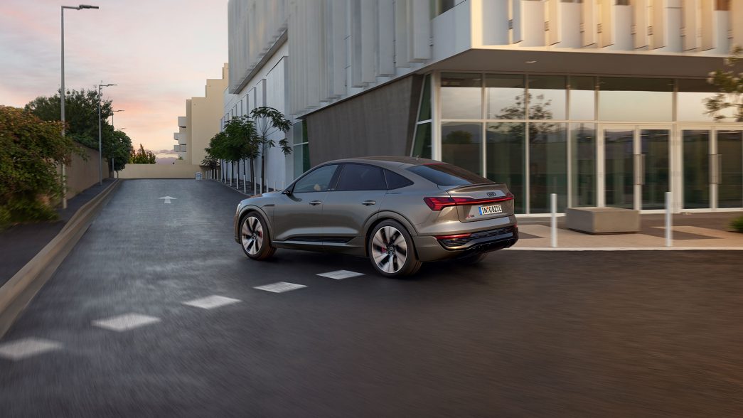 Grey Audi Q8 e-tron in the city side view