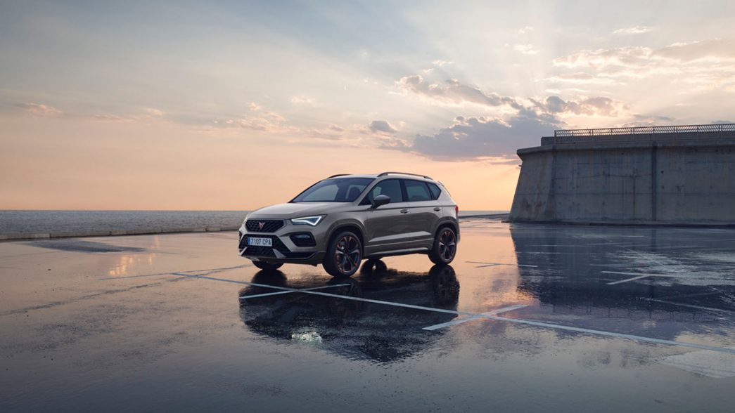 CUPRA Ateca on reflective background, subtle sunset in the background