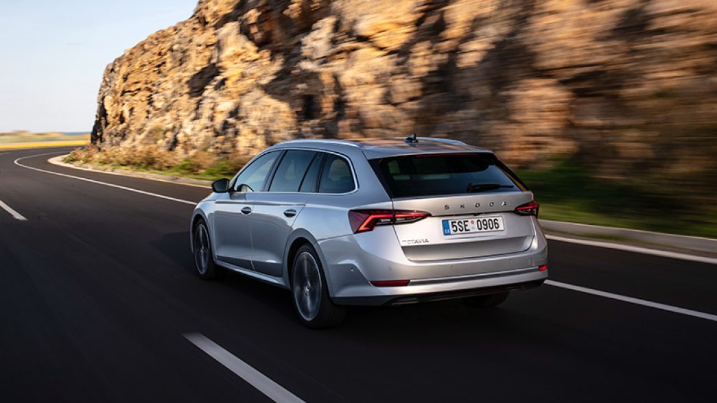 Grey Škoda Octavia rear and side view on a mountain street