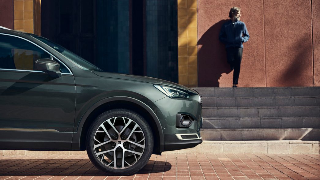 SEAT Tarraco silhouetted, man in background