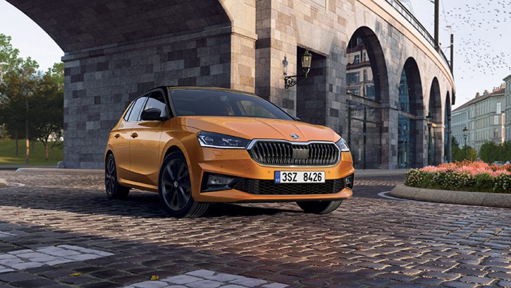 Orange Škoda Fabia front and side view